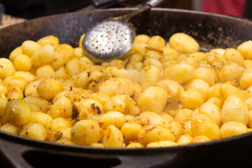 Baking potatoes on a large pan.