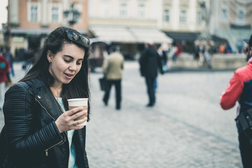 woman drinks coffee outside