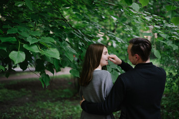 couple fool around  in city park