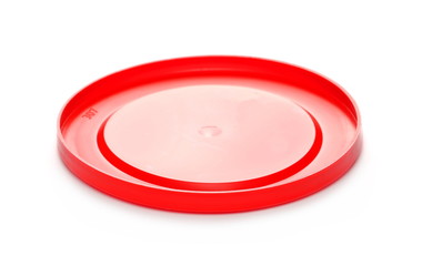Round red plastic bucket lid isolated on white background 