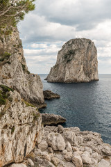 Fototapeta na wymiar View of Capri (Campania, Italy) typical Faraglioni (sea stacks)