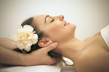 Obraz na płótnie Canvas Woman enjoying a massage treatment. Close up.