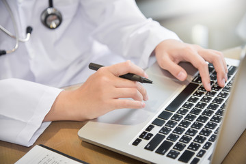 Fototapeta premium Female Doctor working with laptop.