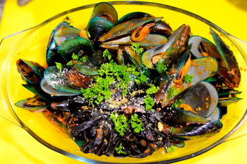 Black pasta with baked green mussel