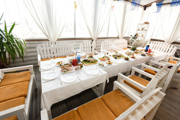 Foods and drinks on a banquet table in a restaurant
