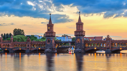 Berlin sunset city skyline at Oberbaum Bridge and Spree River, Berlin, Germany