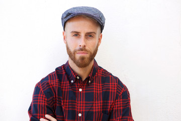 handsome young man with hat against isolated white background