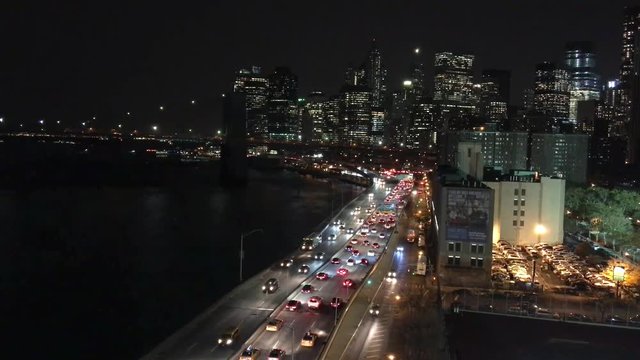 NEW YORK CITY - OCTOBER 2015: Aerial view of FDR Drive at night. The city attracts 50 million tourists every year
