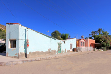 Fototapeta na wymiar Colorful traditional houses in the streets of the Mission San Ignacio, Baja California Sur, Mexico