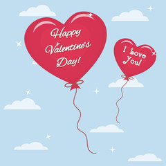 Fototapeta na wymiar Two balloons with text congratulations on Valentine's Day fly in the sky.