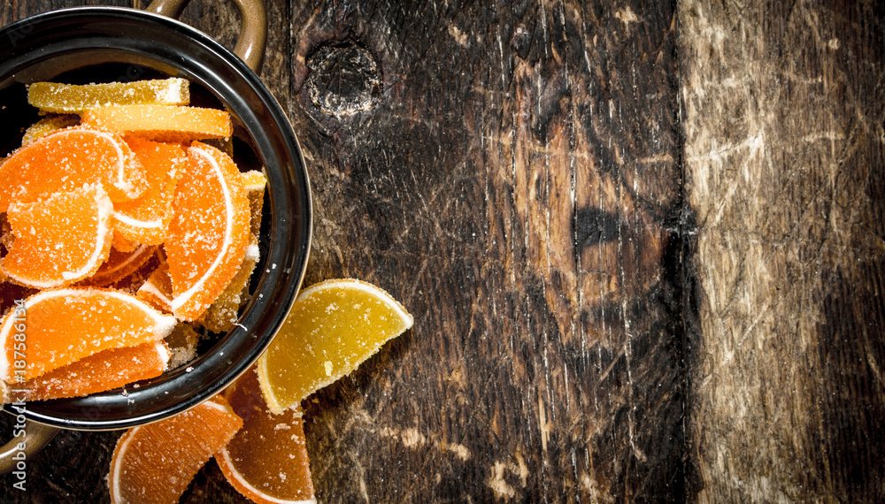 Wall mural Fruit jelly in bowl. On wooden background.