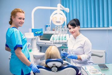 The dentist treats the patient in the clinic