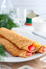 Pancakes with red caviar on plate. Russian cuisine. Maslenitsa