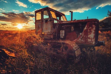 Foto auf Acrylglas HDR image of old rusty tractor in a field. Sunset shot © ValentinValkov