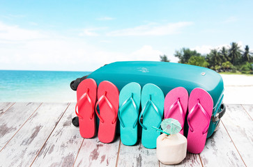 Summer concept, flip-flops, summer accessories on summer beach