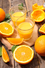 orange juice on wood background