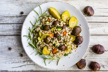 Chestnut salad with pearl barley and vegetables. 