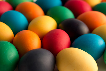 Easter concept painted eggs on white table for holiday with place for text pattern with frame