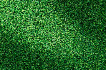 Fototapeta premium Green grass texture or green grass background for golf course. soccer field or sports background concept design. Artificial green grass.