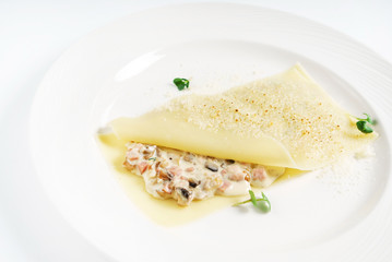 stuffed pancake on white plate