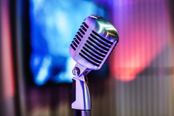 Fototapeta na wymiar Retro microphone on stage in a pub