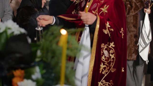 Christian priest with a thurible slow motion