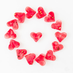 Water melon cut into heart shape on white background. Love concept. Valentine's Day Concept. Flat lay, Top view