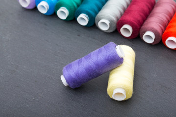 Set of colorful spools of thread isolated