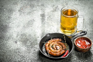 glass of beer with hot sausage.