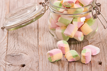 Marshmallows on wooden table. 