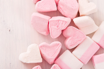 Marshmallows on wooden table. 