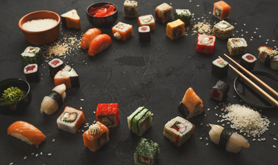 Sushi and rolls background, frame on black