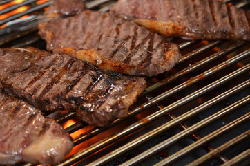 Beef steaks on the grill