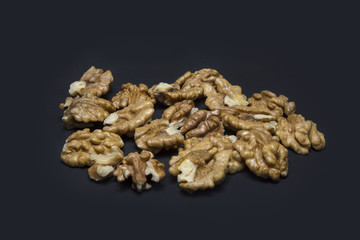 Walnuts on black  background. Copy space. Concept.
