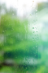 Wet window with drops, raining