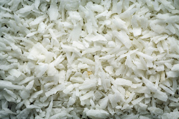 Desiccated coconut flakes macro Background