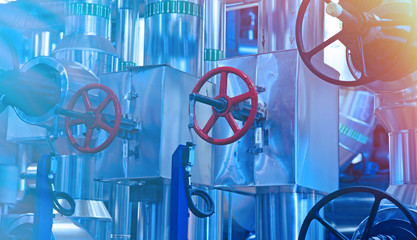 Equipment, cables and piping as found inside of a modern industrial power plant