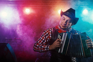 The actor plays the accordion.
