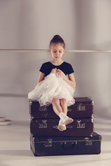 The little girl as balerina dancer sitting at studio © master1305
