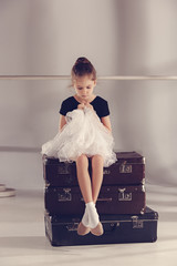 The little girl as balerina dancer sitting at studio © master1305