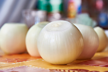 Peeled onions in kitchen