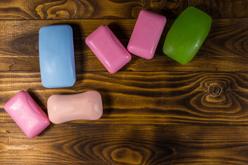 Set of colorful soap on wooden background