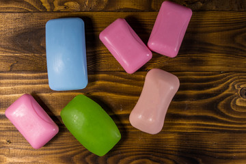 Set of colorful soap on wooden background