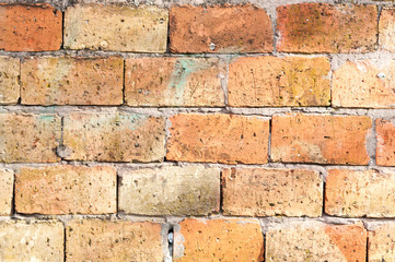 Orange brick wall facade of unfinished house or building