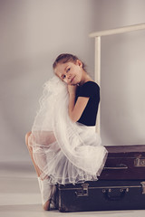 The little girl as balerina dancer sitting at studio © master1305