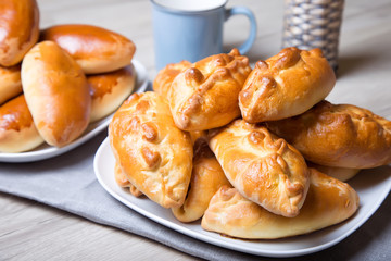 Traditional Russian baked pies (pirozhki). Close-up, selective focus.