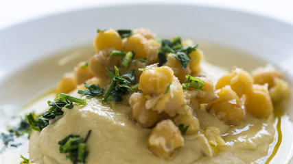 Hummus plate with parsley 