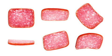 Salami smoked sausage, basil leaves and peppercorns isolated on white background cutout