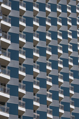 Balconies and the facade of the building. Geometric figures. Backgrounds and textures.