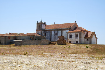 Fototapeta na wymiar The view of Nossa Senhora do Cabo Church on the cape Espichel in Sesimbra, Portugal
